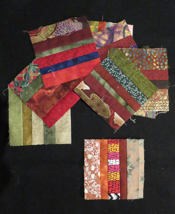 The blocks are a riot of color - anything goes as long as the strips finish around 1/4" wide. Narrower than that becomes difficult to deal with seam allowances